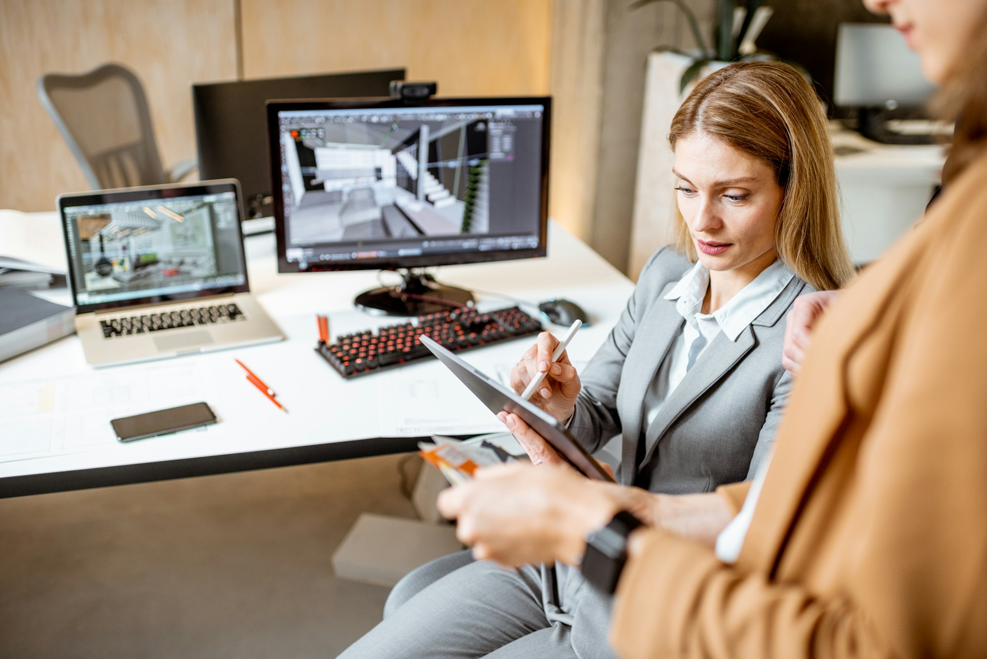 Colleagues working on architectural project in the office